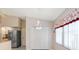 Kitchen and dining nook featuring modern lighting fixture at 4407 Whitton Way, New Port Richey, FL 34653
