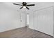 Bedroom featuring ceiling fan, tile floors, closet, and white walls and doors at 4535 15Th S Ave, St Petersburg, FL 33711