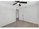 Bright bedroom featuring modern ceiling fan and light gray wood-look tile flooring at 4535 15Th S Ave, St Petersburg, FL 33711