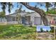 Charming home with stone accents, a well-manicured lawn, and a one-car garage at 4535 15Th S Ave, St Petersburg, FL 33711
