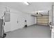 Spacious garage with white walls, concrete floor, and a door to the outside at 4535 15Th S Ave, St Petersburg, FL 33711