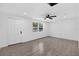 Well-lit living room featuring a window, wood-look floors, and freshly painted walls, ready for personal touches at 4535 15Th S Ave, St Petersburg, FL 33711