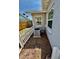 This backyard has an air conditioning unit, a white picket fence, and lush green grass at 5215 76Th N N St, St Petersburg, FL 33709