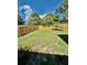The property is secured with a tall wooden fence, creating a private outdoor space at 5215 76Th N N St, St Petersburg, FL 33709