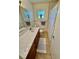 Bathroom features a vanity, toilet, mirror, and shower-tub combo at 5215 76Th N N St, St Petersburg, FL 33709