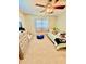 Bedroom features a dresser, window, and bed, creating a cozy and functional space at 5215 76Th N N St, St Petersburg, FL 33709