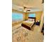 This bedroom features a ceiling fan, a decorative rug, and a cozy bed with multiple pillows at 5215 76Th N N St, St Petersburg, FL 33709