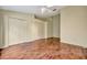 Spacious bedroom boasts gleaming hardwood floors and ample closet space at 5502 Carrollwood Key Dr, Tampa, FL 33624
