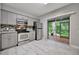 Modern kitchen with stainless steel appliances, stylish countertops, and a view of the screened lanai at 5502 Carrollwood Key Dr, Tampa, FL 33624