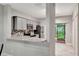 Well-lit kitchen featuring stainless steel appliances, granite countertops and easy access to the patio at 5502 Carrollwood Key Dr, Tampa, FL 33624