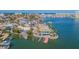 Aerial view of a waterfront property showcasing its dock, landscaping, and coastal charm at 5950 Bikini N Way, St Pete Beach, FL 33706