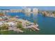 Waterfront home with a pool, dock, and lush landscaping, offering a luxurious lifestyle at 5950 Bikini N Way, St Pete Beach, FL 33706