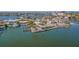 Waterfront property with lush landscaping, a private dock, and stunning water views at 5950 Bikini N Way, St Pete Beach, FL 33706