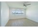 Bright bedroom offers water views, laminate wood flooring, and ceiling fan at 5950 Bikini N Way, St Pete Beach, FL 33706