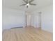 Large bedroom with multiple closets, and laminate wood flooring at 5950 Bikini N Way, St Pete Beach, FL 33706