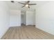 This bedroom features a ceiling fan, a closet, and luxury vinyl plank flooring at 5950 Bikini N Way, St Pete Beach, FL 33706