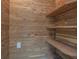 This wood closet has multiple shelves and an electrical outlet at 5950 Bikini N Way, St Pete Beach, FL 33706