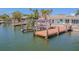 Property with a private dock and boat lift, offering direct access to the water at 5950 Bikini N Way, St Pete Beach, FL 33706