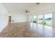 Open living area with large windows showcasing waterfront views and a textured ceiling at 5950 Bikini N Way, St Pete Beach, FL 33706