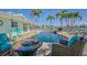 A beautifully landscaped pool area features a lovely pool and gorgeous waterfront views at 5950 Bikini N Way, St Pete Beach, FL 33706