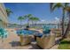 This landscaped pool area is the perfect spot for waterfront relaxation with comfortable outdoor seating at 5950 Bikini N Way, St Pete Beach, FL 33706