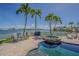 Outdoor pool and spa overlooking tranquil waterfront, perfect for relaxation and entertaining at 5950 Bikini N Way, St Pete Beach, FL 33706