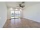 Spacious bonus room featuring tile floors and sliding glass doors to the water at 5950 Bikini N Way, St Pete Beach, FL 33706
