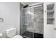 Modern bathroom with a sleek glass shower enclosure and contemporary fixtures for a spa-like experience at 6220 Murdock Ave, Sarasota, FL 34231