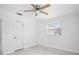 Comfortable bedroom featuring a ceiling fan, bright natural light, and a view to the outdoors at 6220 Murdock Ave, Sarasota, FL 34231