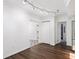 Dining room features hardwood floors and arched track lighting at 6220 Murdock Ave, Sarasota, FL 34231
