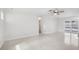 Spacious living area featuring sleek floors, a modern ceiling fan, and seamless indoor-outdoor flow with pool views at 6220 Murdock Ave, Sarasota, FL 34231