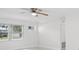 Bright living room features a ceiling fan and large window with outside view at 6220 Murdock Ave, Sarasota, FL 34231