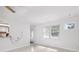 Bright living room with natural light, white walls, and view into open kitchen design; ready for entertaining at 6220 Murdock Ave, Sarasota, FL 34231