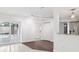 Bright living area with modern lighting, seamless flow to a pool view, and stylish transition to wood flooring at 6220 Murdock Ave, Sarasota, FL 34231