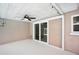 Screened patio with ceiling fan and sliding glass doors at 6220 Murdock Ave, Sarasota, FL 34231