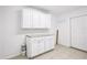 Utility room with white cabinets and counterspace at 6220 Murdock Ave, Sarasota, FL 34231