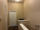 Hallway featuring tan walls, with easy access to the bedrooms and a ceiling light at 6252 Olivedale Dr, Riverview, FL 33578