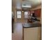 Well-lit kitchen featuring stainless steel appliances, granite countertops and ample cabinetry at 6252 Olivedale Dr, Riverview, FL 33578