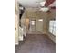 Spacious living room featuring neutral walls and a view of the staircase and kitchen at 6252 Olivedale Dr, Riverview, FL 33578