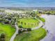 Aerial view of community great lawn with meandering walking path at 6408 Seasound Dr, Apollo Beach, FL 33572