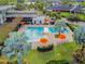 Aerial view of community pool, lounge seating, and manicured landscaping at 6408 Seasound Dr, Apollo Beach, FL 33572