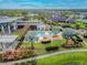 Aerial view of community pool with umbrellas and lounge chairs at 6408 Seasound Dr, Apollo Beach, FL 33572