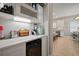 Well-appointed bar area featuring a wine fridge, plenty of storage, and a convenient setup for hosting gatherings at 6408 Seasound Dr, Apollo Beach, FL 33572