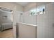 Sleek bathroom with a glass shower and natural light from a garden window at 6408 Seasound Dr, Apollo Beach, FL 33572