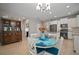 Dining area with blue accents and a view of the kitchen creates a cozy and inviting space for meals at 6408 Seasound Dr, Apollo Beach, FL 33572