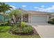 Charming single-story home with a well-manicured lawn and a cozy front porch and a two car garage at 6408 Seasound Dr, Apollo Beach, FL 33572