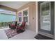 Inviting front porch with comfortable seating and stylish decor, perfect for relaxing outdoors at 6408 Seasound Dr, Apollo Beach, FL 33572