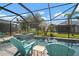 Relaxing screened pool area with comfortable lounge chairs and a lush landscape view at 6408 Seasound Dr, Apollo Beach, FL 33572