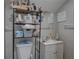 Functional bathroom includes shelving for storage and a white sink and vanity at 659 26Th S Ave, St Petersburg, FL 33705