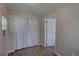 Neutrally painted bedroom has laminate flooring, and closet storage space at 659 26Th S Ave, St Petersburg, FL 33705